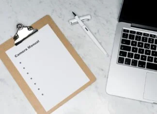 white paper on silver laptop computer