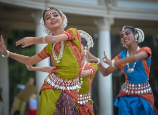 three woman performing traditional dance