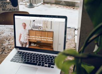 MacBook Pro on top of brown wooden table during daytime