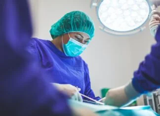woman wears green face mask