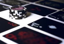 poker chip on white surface
